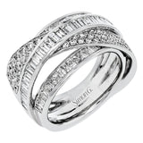 Bold and modern, this 18k white gold ring contains 1.11 ctw of baguette diamonds and .48 ctw of round diamonds set into a dynamic, overlapping design.