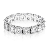 This lovely 18k white gold eternity band is a classic design with a vintage inspired twist, with 4.64 ctw of Asscher cut diamonds extending around the entirety of the ring.