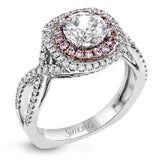 This lovely halo engagement ring is crafted in tones of 18k rose and white gold and contains .36 ctw of white diamonds along with .18 ctw of pink diamonds.
