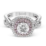 This lovely halo engagement ring is crafted in tones of 18k rose and white gold and contains .36 ctw of white diamonds along with .18 ctw of pink diamonds.