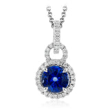 Classically elegant, this white gold pendant features a halo setting glittering with .20 ctw of round white diamond accents.