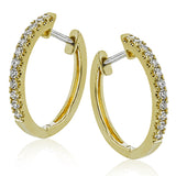 These classic hoop earrings are crafted from 18k white gold and set with .25 ctw of shining white diamonds.