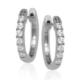These timeless 18k white gold hoop earrings are set with .55 ctw of dazzling white diamonds.