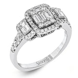 This balanced, geometric 18k white gold design showcases .46 ctw of round diamonds, .32 ctw of baguette diamonds, and .36 ctw of emerald cut diamonds.