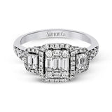 This balanced, geometric 18k white gold design showcases .46 ctw of round diamonds, .32 ctw of baguette diamonds, and .36 ctw of emerald cut diamonds.
