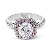 This classic style ring is formed from 18k white and rose gold. The halo design is set with .25 ctw of white diamonds as well as .18 ctw of pink diamonds.