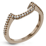This classic style ring is formed from 18k white and rose gold. The halo design is set with .25 ctw of white diamonds as well as .18 ctw of pink diamonds.
