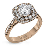 This 18k white gold engagement ring setting has a stunning double halo design set with .61 ctw of shining white round brilliant diamonds.