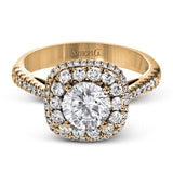 This 18k white gold engagement ring setting has a stunning double halo design set with .61 ctw of shining white round brilliant diamonds.