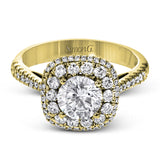 This 18k white gold engagement ring setting has a stunning double halo design set with .61 ctw of shining white round brilliant diamonds.