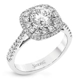 This 18k white gold engagement ring setting has a stunning double halo design set with .61 ctw of shining white round brilliant diamonds.