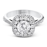 This 18k white gold engagement ring setting has a stunning double halo design set with .61 ctw of shining white round brilliant diamonds.