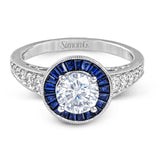 This 18k white gold engagement ring add something special with .56 ctw of baguette sapphires in a halo around the center stone. A total of .36 ctw of white diamonds finish this remarkable design.