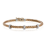 This wonderful bracelet is woven from pure 18k rose gold, with a rich warmth which sets off the .33 ctw of white diamonds in its midst. Perfect for stacking.