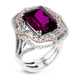 This vintage-inspired two-tone 18k gold ring centers on an extraordinary 7.03 rubellite stone which is surrounded by .67 ctw of white diamonds.