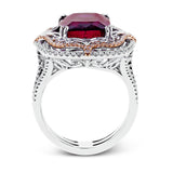 This vintage-inspired two-tone 18k gold ring centers on an extraordinary 7.03 rubellite stone which is surrounded by .67 ctw of white diamonds.