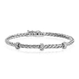 This woven 18k white gold bracelet is ideal for layering, but can also stand on its own. A total of .33 ctw of white diamonds add sparkle to this piece. Perfect for stacking.