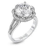 This lovely 18k white gold engagment setting features a wavy halo reminiscent of an opening flower set with .50 ctw of white diamonds.