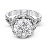 This lovely 18k white gold engagment setting features a wavy halo reminiscent of an opening flower set with .50 ctw of white diamonds.