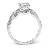 This distinctive 18k white gold ring has an intricate design reminiscent of lover's knots and eternity symbols, set with .33 ctw of white diamonds.