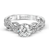 This distinctive 18k white gold ring has an intricate design reminiscent of lover's knots and eternity symbols, set with .33 ctw of white diamonds.