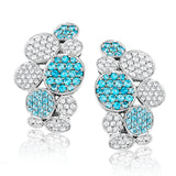 These remarkable 18k white gold earrings feature 1.18 ctw of incredible bright blue paraiba tourmaline paired with 1.33 ctw of white diamonds.
