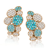 These remarkable 18k white gold earrings feature 1.18 ctw of incredible bright blue paraiba tourmaline paired with 1.33 ctw of white diamonds.