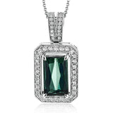 This graceful 18k white gold pendant features a 4.25 ct rectangular green tourmaline in the center, surrounded by .30 ctw of white diamonds.