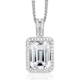 This graceful 18k white gold pendant features a 4.25 ct rectangular green tourmaline in the center, surrounded by .30 ctw of white diamonds.