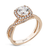This sparkling modern engagement ring features an eye-catching twisted design with elegant classic halo accented by .29 ctw of shimmering round cut white diamonds.
