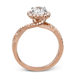 This sparkling modern engagement ring features an eye-catching twisted design with elegant classic halo accented by .29 ctw of shimmering round cut white diamonds.