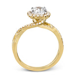 This sparkling modern engagement ring features an eye-catching twisted design with elegant classic halo accented by .29 ctw of shimmering round cut white diamonds.