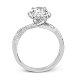 This sparkling modern engagement ring features an eye-catching twisted design with elegant classic halo accented by .29 ctw of shimmering round cut white diamonds.