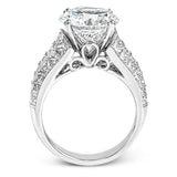Crafted from 18k white gold, this modern engagement ring commends attention with 1.34 ctw of princess cut diamonds in combination with 1.42 ctw of baguette diamonds.