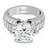 Crafted from 18k white gold, this modern engagement ring commends attention with 1.34 ctw of princess cut diamonds in combination with 1.42 ctw of baguette diamonds.