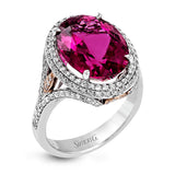 A beautiful 7.55 ct oval rubellite sits at the center of this enchanting 18k white gold ring with accents of 18k rose gold. A beautiful .70 ctw of white diamonds finishes this lovely design.