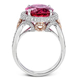 A beautiful 7.55 ct oval rubellite sits at the center of this enchanting 18k white gold ring with accents of 18k rose gold. A beautiful .70 ctw of white diamonds finishes this lovely design.