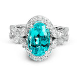 This ring is truly extraordinary, centering around an incredibly bright 4.04 ctw paraiba tourmaline. This is surrounded by .31 ctw of round diamonds and .66 ctw of pear shaped diamonds set into nature inspired elements crafted in 18k white gold.