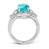 This ring is truly extraordinary, centering around an incredibly bright 4.04 ctw paraiba tourmaline. This is surrounded by .31 ctw of round diamonds and .66 ctw of pear shaped diamonds set into nature inspired elements crafted in 18k white gold.