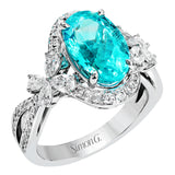 This ring is truly extraordinary, centering around an incredibly bright 4.04 ctw paraiba tourmaline. This is surrounded by .31 ctw of round diamonds and .66 ctw of pear shaped diamonds set into nature inspired elements crafted in 18k white gold.