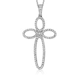This open, modern take on a cross pendant is rendered in 18k white and rose gold and set with a .03 ct pink diamond and .35 ctw of white diamonds.