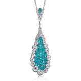 This pendant's stunning .50 ctw of blue paraiba instantly grabs all the attention in the room and is surrounded by 1.10 ctw of round brilliant white diamonds.