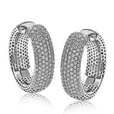 These 18k white gold hoop earrings have a modern, rounded design and contain 2.00 ctw of round brilliant white diamonds.