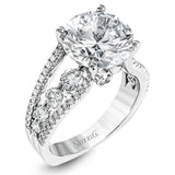 This amazing 18k white gold engagement ring contains 1.66 ctw of white round brilliant diamonds in a modern yet classic design.