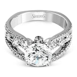 This 18k white gold engagment ring is a modern take on a classic design with 1.12 ctw of round white diamonds.
