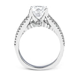 This 18k white gold engagment ring is a modern take on a classic design with 1.12 ctw of round white diamonds.