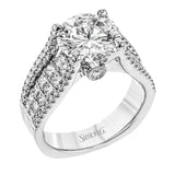 This bold 18k white gold engagement setting contains 1.04 ctw of princess cut diamonds alongside .40 ctw of round brilliant diamonds.