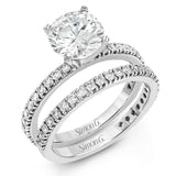 This beautiful 18k white gold wedding set contains a stunning .75 ctw of white round brilliant diamonds.