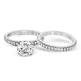 This beautiful 18k white gold wedding set contains a stunning .75 ctw of white round brilliant diamonds.