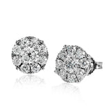 This stud earrings are a modern update on a classic, with .80 ctw of round white diamonds surrounding .63 ctw center diamonds.